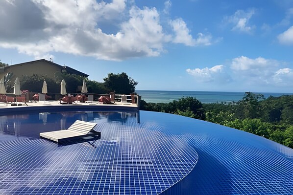 Deluxe Bungalow | Pool | Outdoor pool, open 8:00 AM to 6:00 PM, pool umbrellas, pool loungers