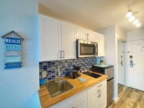 Fridge, microwave, stovetop, coffee/tea maker