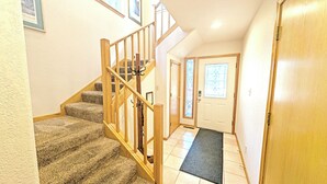 A staircase with wooden railings leading to a landing. - Mt Hood 13 - A/C, Hot Tub, 2 Suites, SHARC (Sunriver)