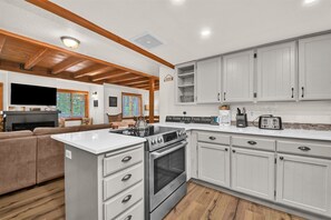 Oven, dishwasher, coffee/tea maker, cookware/dishes/utensils