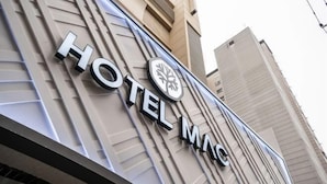 A hotel sign with the name "HOTEL MAC" and a logo. - Mac Hotel (Seoul)