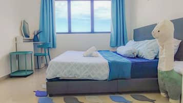 A bedroom with a bed, a desk, a chair, and a window with curtains.