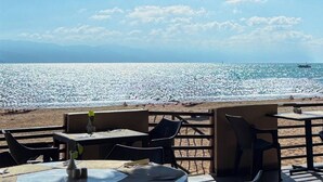 A beachside café with outdoor seating overlooking the ocean. - Spacious, with access to the pool and the beach! (Puerto Vallarta)