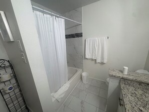 Hair dryer, towels, soap, toilet paper