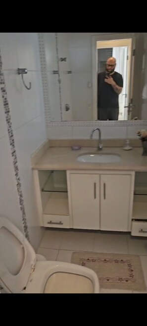 Bidet, towels, soap, toilet paper