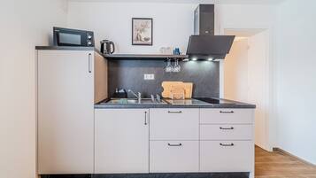 Fridge, microwave, stovetop, cookware/dishes/utensils