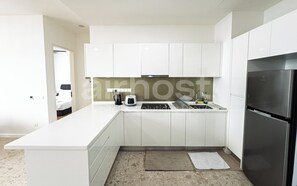 Deluxe Condo, Kitchen, City View | Private kitchen