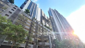 A modern high-rise building with multiple floors, balconies, and a mix of residential and commercial spaces. - M city service suite KLCC (Kuala Lumpur)