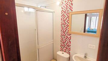 Shower, hair dryer, towels, soap