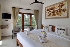 A hotel room with a bed, a television, a balcony, and a painting. - Lemon Tree Hotel Bali (Bali)