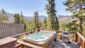A hot tub on a wooden deck with a view of mountains and trees. - Endless Mtn Views! Group Ski Lodge at Sugar Bowl (Norden)