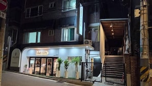 A two-story building with a cafe named 'Eden Cafe' on the ground floor. - EDEN GUEST HOUSE (Seoul)