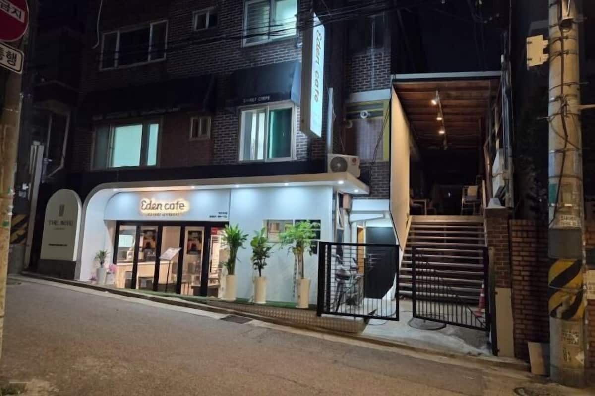 A two-story building with a cafe named 'Eden Cafe' on the ground floor.