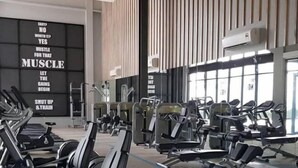 A gym with various exercise equipment, motivational posters on the wall, and large windows allowing natural light. - Lakeville KL Taman Wahyu City Centre [3Bedroom Sleep 5] (Kuala Lumpur)
