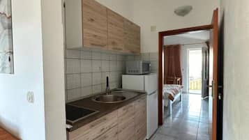 Fridge, microwave, stovetop, dining tables