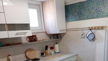 Fridge, stovetop, coffee/tea maker, dining tables