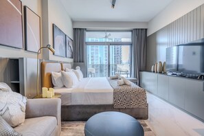 Deluxe Studio, 1 King Bed, Balcony, City View | Living area | 55-inch Smart TV with digital channels