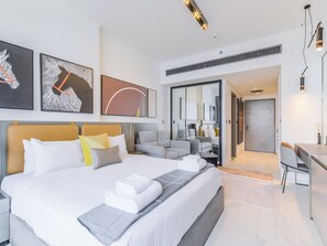 Deluxe Studio, Balcony, City View | Living area | 55-inch Smart TV with digital channels