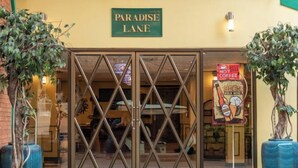 A building entrance with a sign reading "Paradise Lane." - 75 Paradise Lane Managed by Loft Group (Bangkok)