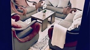 A modern living room with a sofa, armchairs, a coffee table, and a ceiling fan. - Paradise -Sheikh Zayed Residence (El Sheikh Zayed)