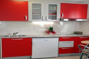Fridge, stovetop, dining tables