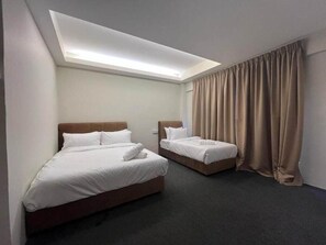 A hotel room with two beds, a skylight, and a large window with curtains. - Swing and Pillows @ Malacca Mahkota Parade (Melaka)