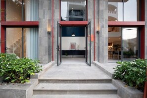 A hotel entrance with a staircase leading to a reception area. - Express by M Village 59 Thao Dien, a brand of Modern Village Lifestyle (Ho Chi Minh City)
