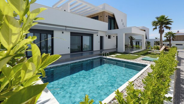 A modern house with a swimming pool, large windows, and a garden. - Emerald Three-Bedroom Villa with Private Pool and Rooftop (Kavala)