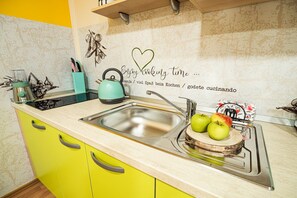 Fridge, microwave, stovetop, coffee/tea maker