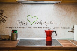 Fridge, microwave, stovetop, coffee/tea maker