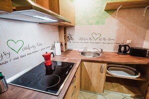 Fridge, microwave, stovetop, coffee/tea maker