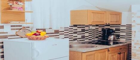 Fridge, stovetop, coffee/tea maker, dining tables