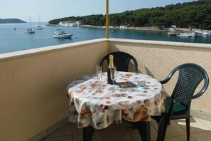 Outdoor dining - One Bedroom Apartment (Prvic Luka)