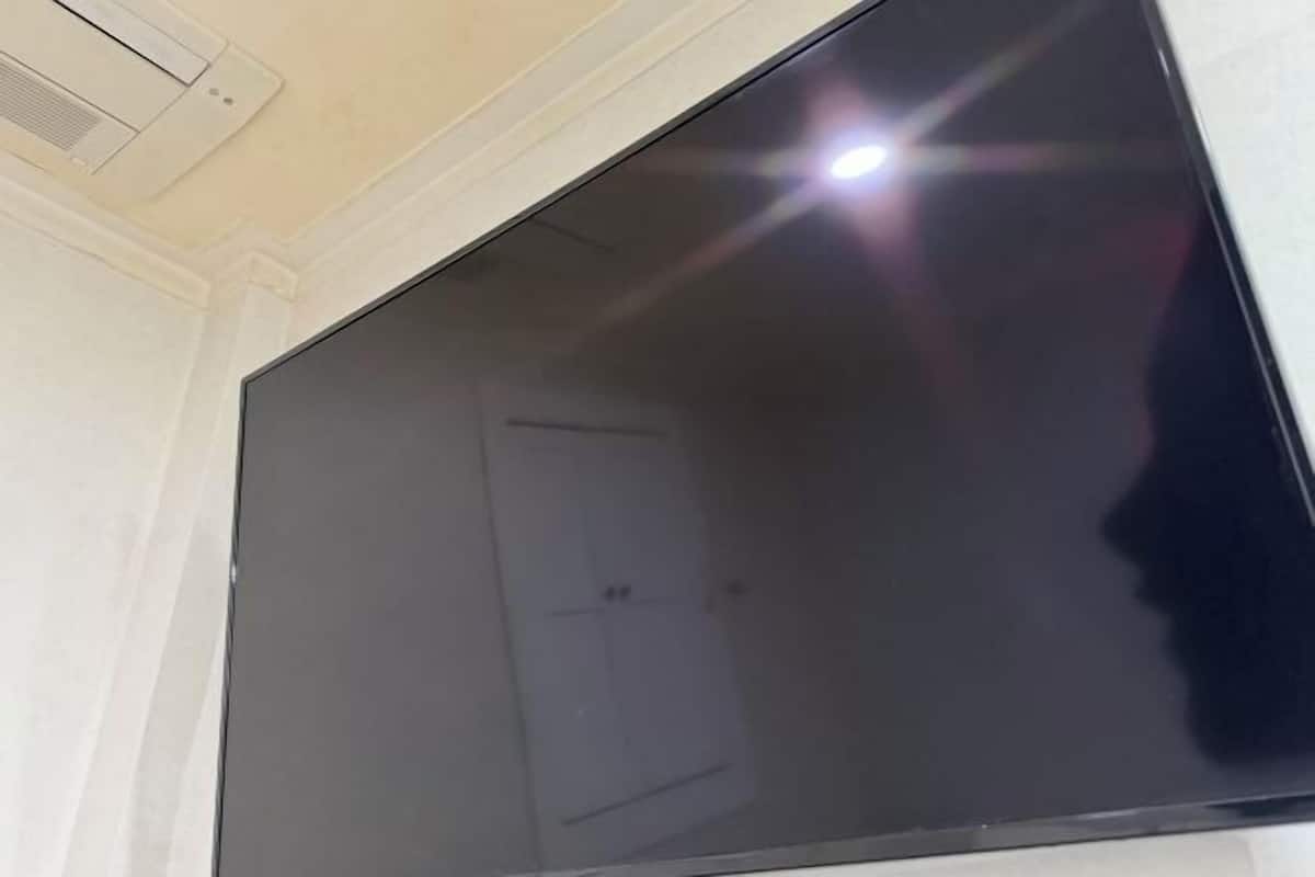 A large flat-screen TV mounted on a wall.