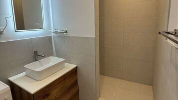 Shower, towels, soap, toilet paper