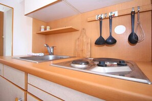 Fridge, microwave, stovetop, coffee/tea maker