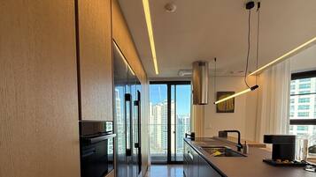 Luxury Penthouse, 3 Bedrooms, City View | Private kitchen | Full-size fridge, microwave, oven, stovetop