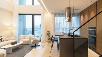 Luxury Apartment, 2 Bedrooms, Balcony | Living area | 85-inch Smart TV with digital channels, Netflix, streaming services