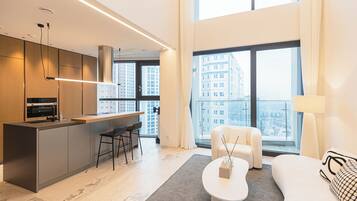 Luxury Apartment, 2 Bedrooms, Balcony, City View | Living area | 85-inch Smart TV with digital channels, Netflix, heated floors