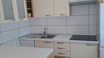 Fridge, stovetop, dishwasher, dining tables