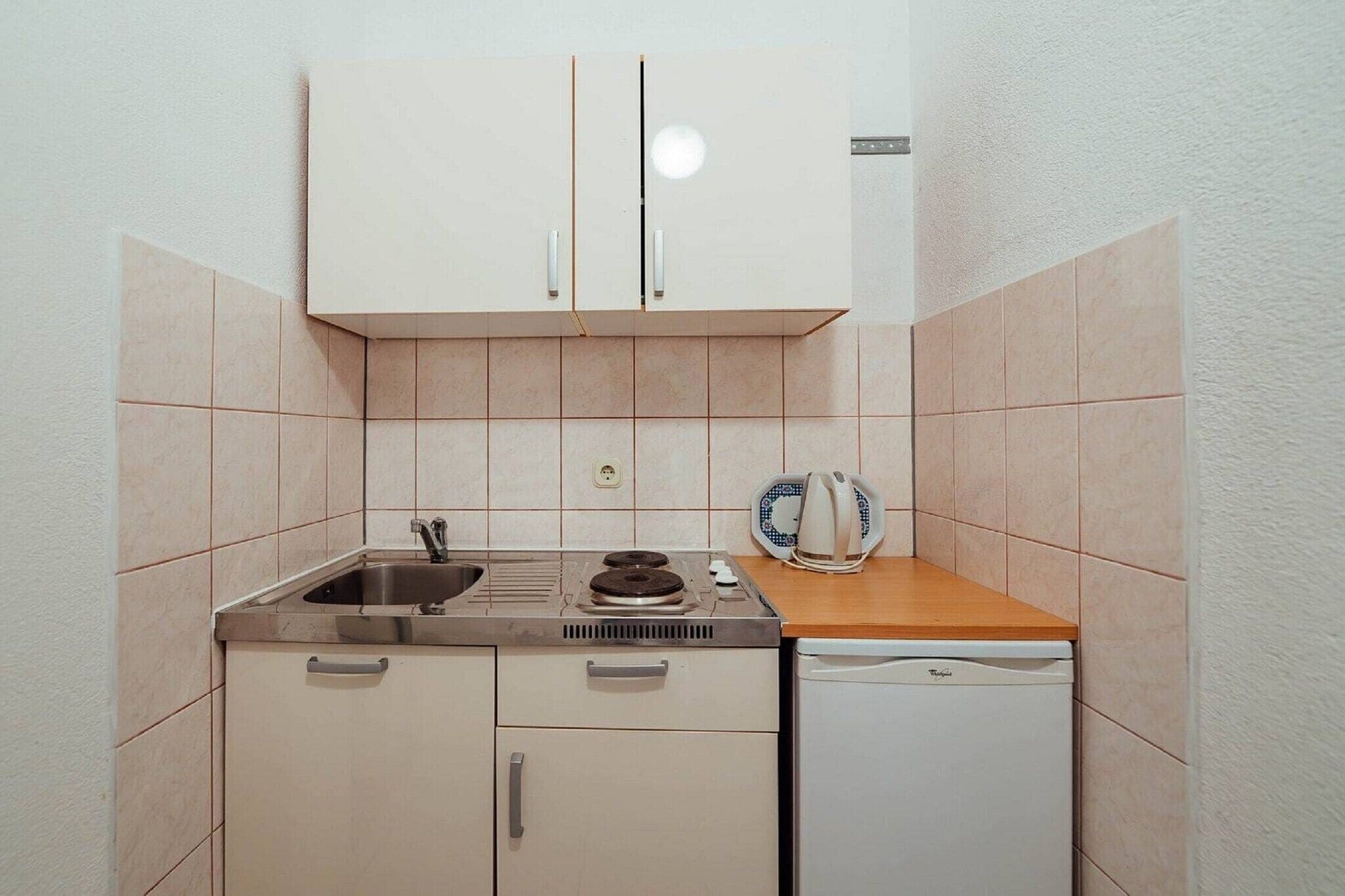 Fridge, stovetop, dining tables
