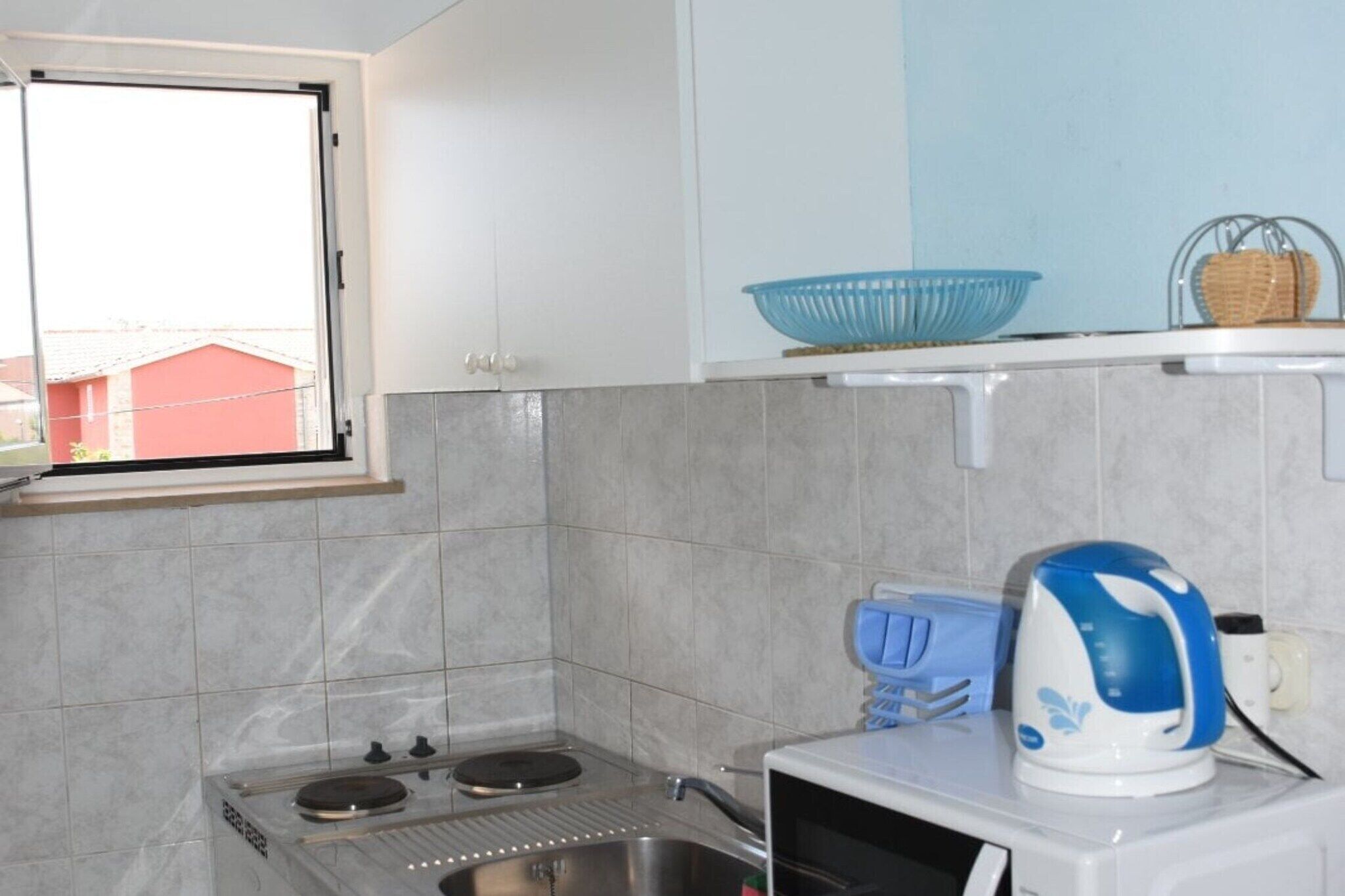 Fridge, microwave, stovetop, dining table