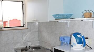 Fridge, microwave, stovetop, dining table