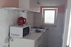 Fridge, microwave, stovetop, dining tables