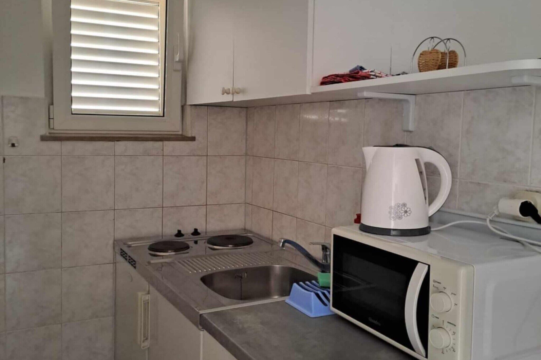 Fridge, microwave, stovetop, dining table