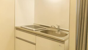 A compact kitchen with a single stainless steel sink and a small countertop. - Lumine Ikebukuro (Tokyo)