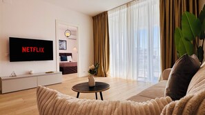 Superior Apartment, 1 Queen Bed with Sofa bed, Courtyard View | Living area | 127-cm Smart TV with digital channels, Netflix, streaming services - Premium Apartments - ONE Cotroceni (Bucharest)