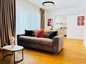 Superior Apartment, 1 Queen Bed with Sofa bed, Courtyard View | Living area | 127-cm Smart TV with digital channels, Netflix, streaming services - Premium Apartments - ONE Cotroceni (Bucharest)