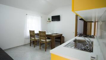 Fridge, stovetop, dining tables
