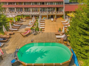 Seasonal outdoor pool, pool umbrellas, sun loungers
